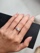 Load image into Gallery viewer, Ring with Center Round Diamond and Round White Diamond Side Stones | Fête Matrimony XXIV
