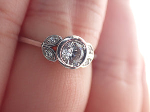 Ring with Center Round Diamond and Round White Diamond Side Stones | Fête Matrimony XXIV