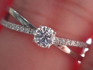 Engagement Ring with a Center Round White Diamond and Round White Side Diamonds | Fête Matrimony XXIII