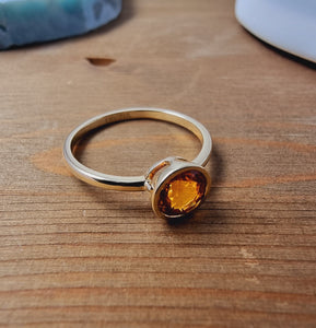 Solitaire Orange Sapphire Ring in Bezel Setting made of 14K Yellow Gold 1.22 TCW